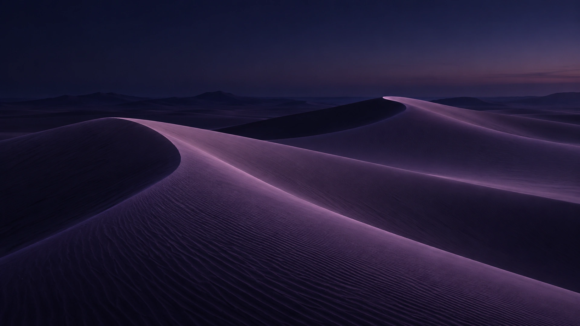 Soft violet sand ridges beneath a calm open horizon, dark desktop composition